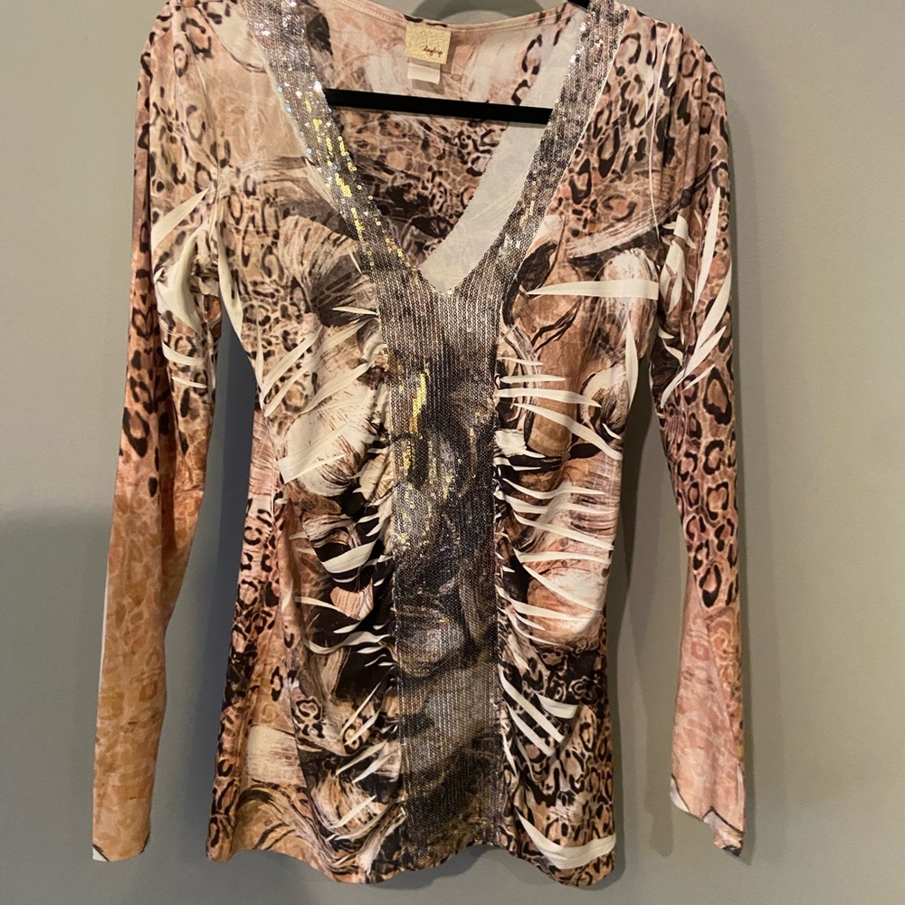Animal print shirt with silver sequins and rushing in the front front.